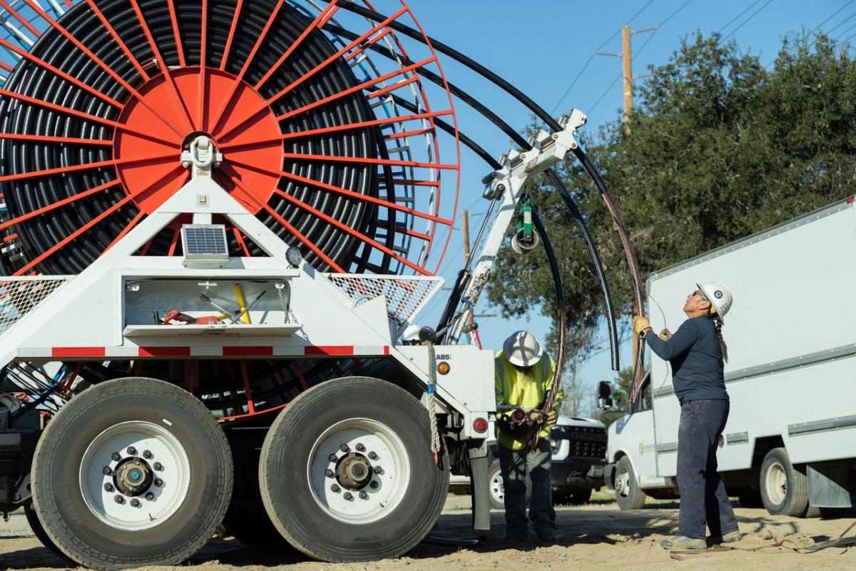 Vasquez works on a puller machine preparing to route underground electrical cables for a residential development.