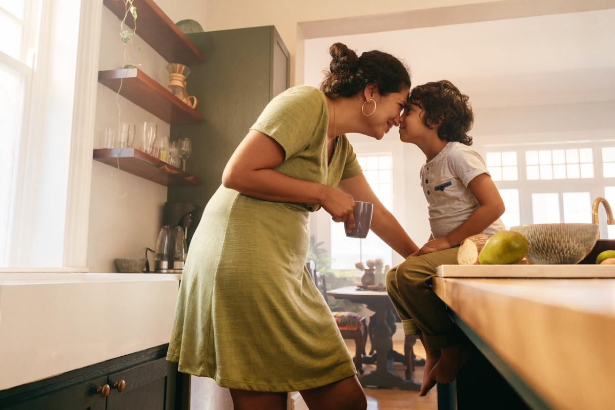 A mom and her son sharing a tender moment.