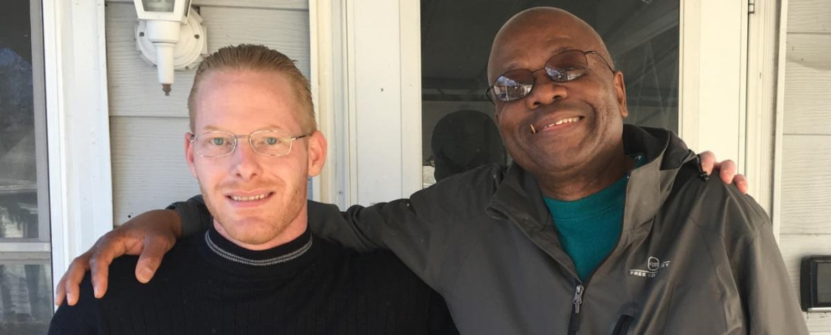 David Williams and John E. Johnson Jr. celebrate Williams’ new home in Des Moines, Iowa, on Nov. 29, 2017.