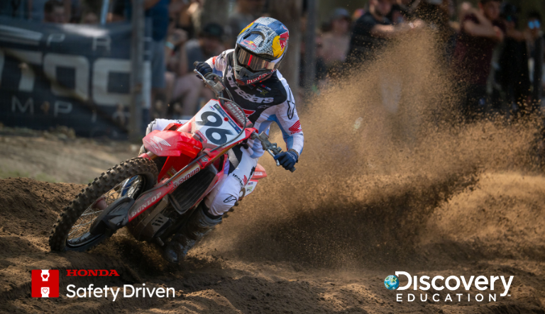 Red motorcycle driving down track