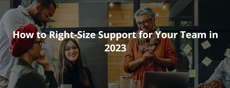 How to Right-Size Support for Your Team in 2023 Blog Image with a team of colleagues working around a desk discussing and smiling.