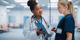 Female doctor and patient shown in consultation.