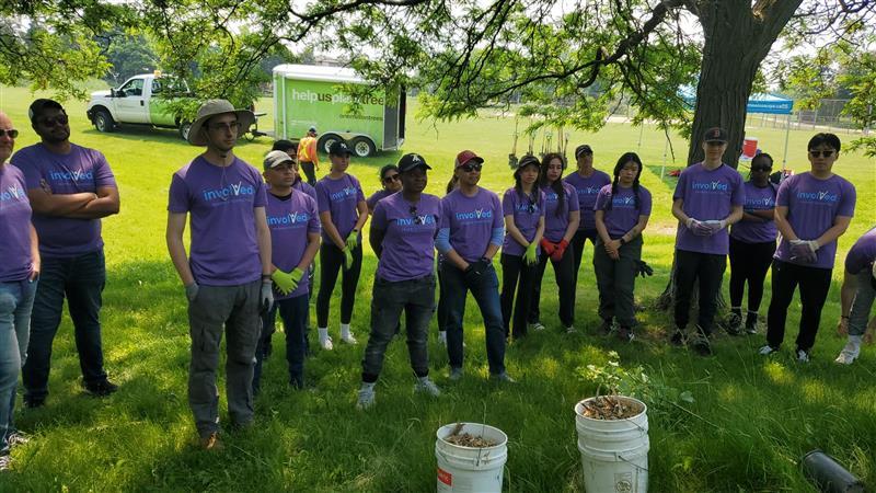 Group of Toronto volunteers standing outside on the grass