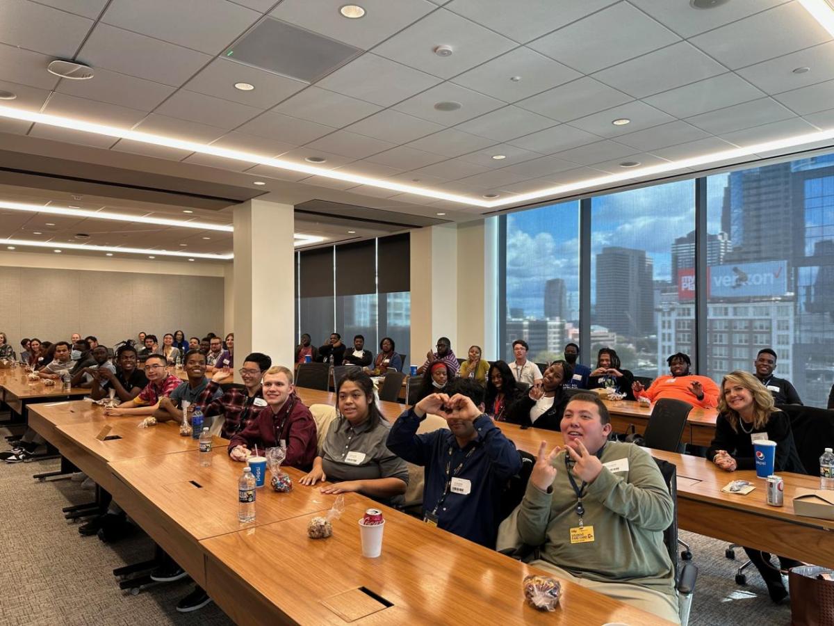 A.J. Drexel Autism Institute students pose for a picture in a conference room