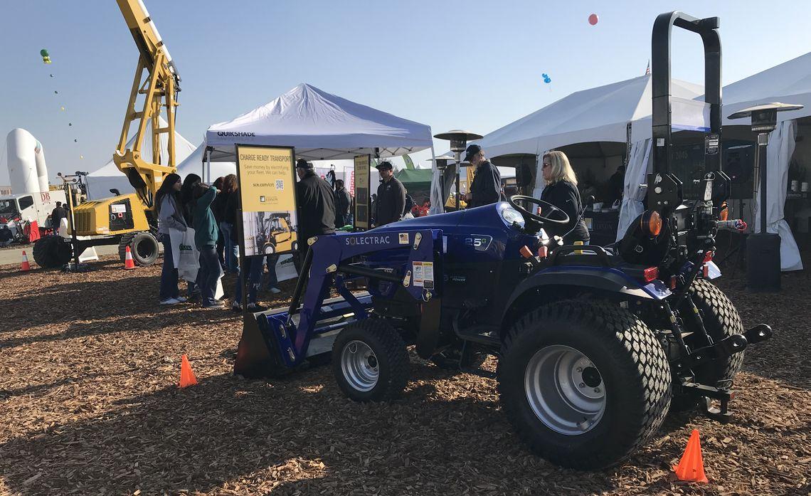 tractor outside near tents at the World Ag Expo 