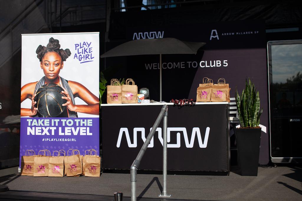 Photo of the Arrow booth with a Play Like a Girl banner