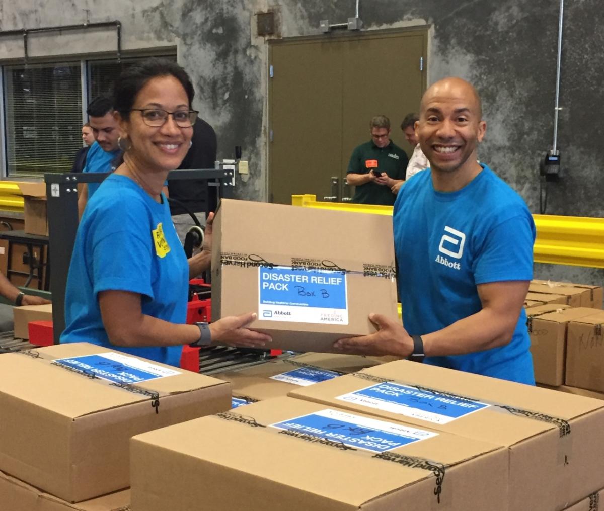 Abbott employees help prepare disaster relief packs at a local food bank.