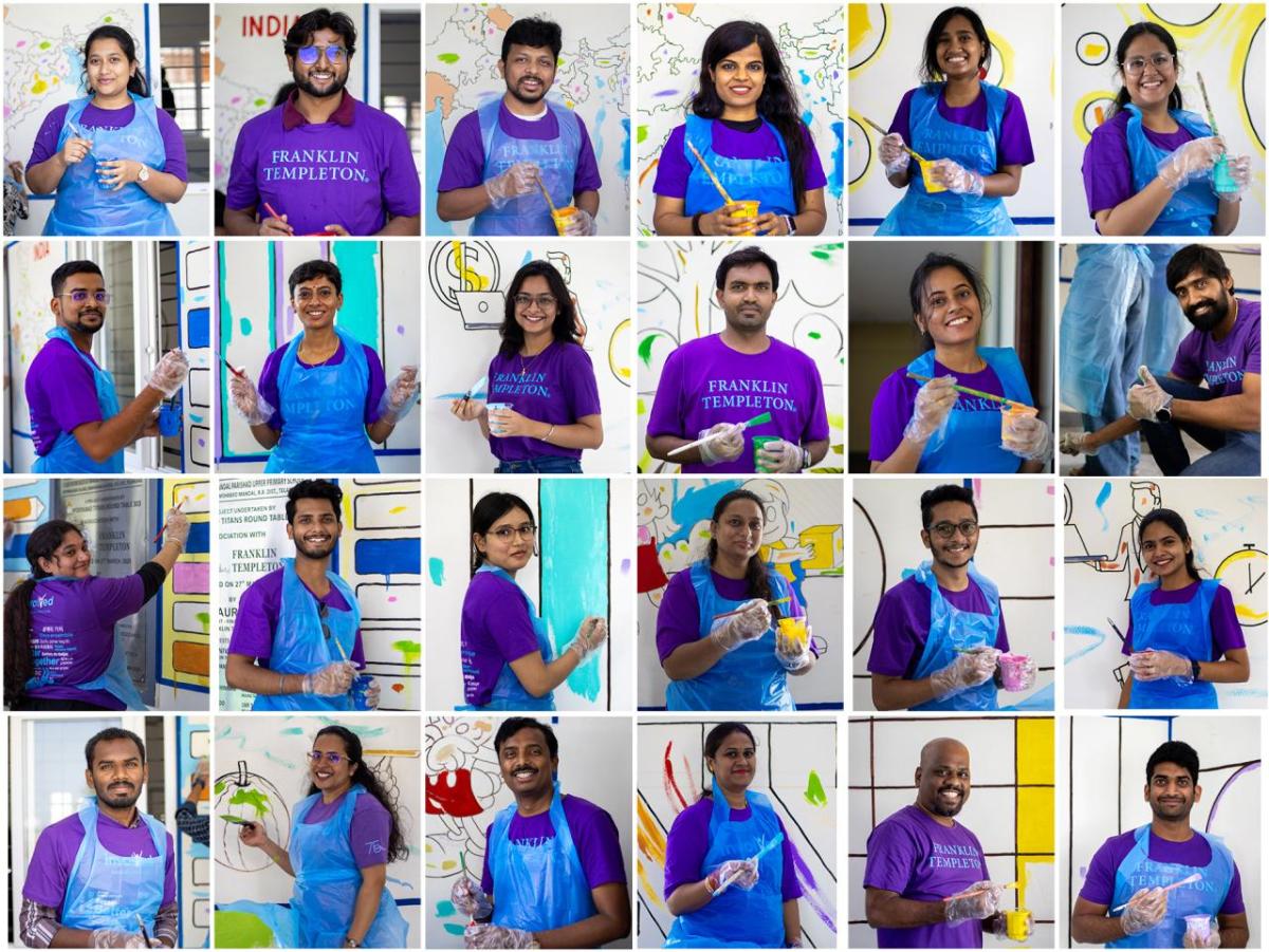 Hyderabad employees paint murals on the school walls. 