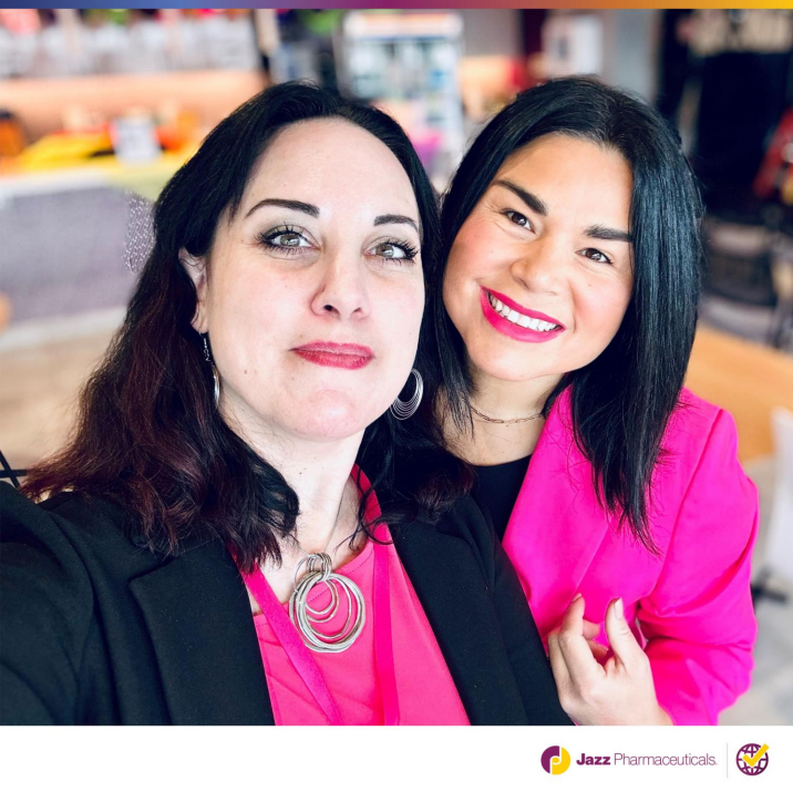 Two smiling people posed for a selfie.