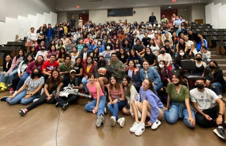 Group of students shown in a class room.