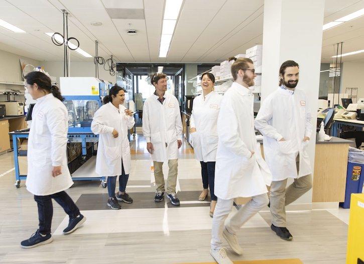 Illumina technicians in a lab.