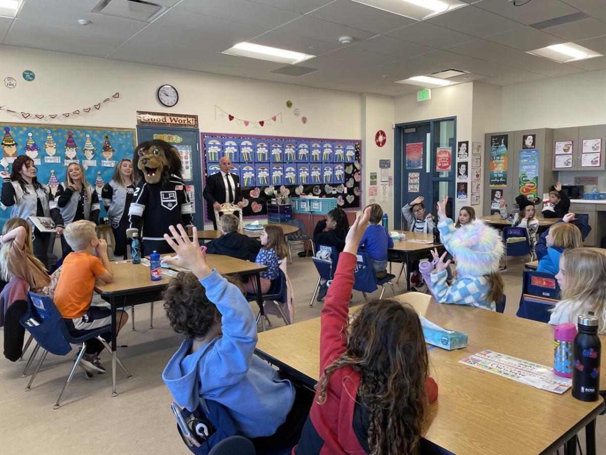 Students ask questions during the reading of "B is for Bailey".