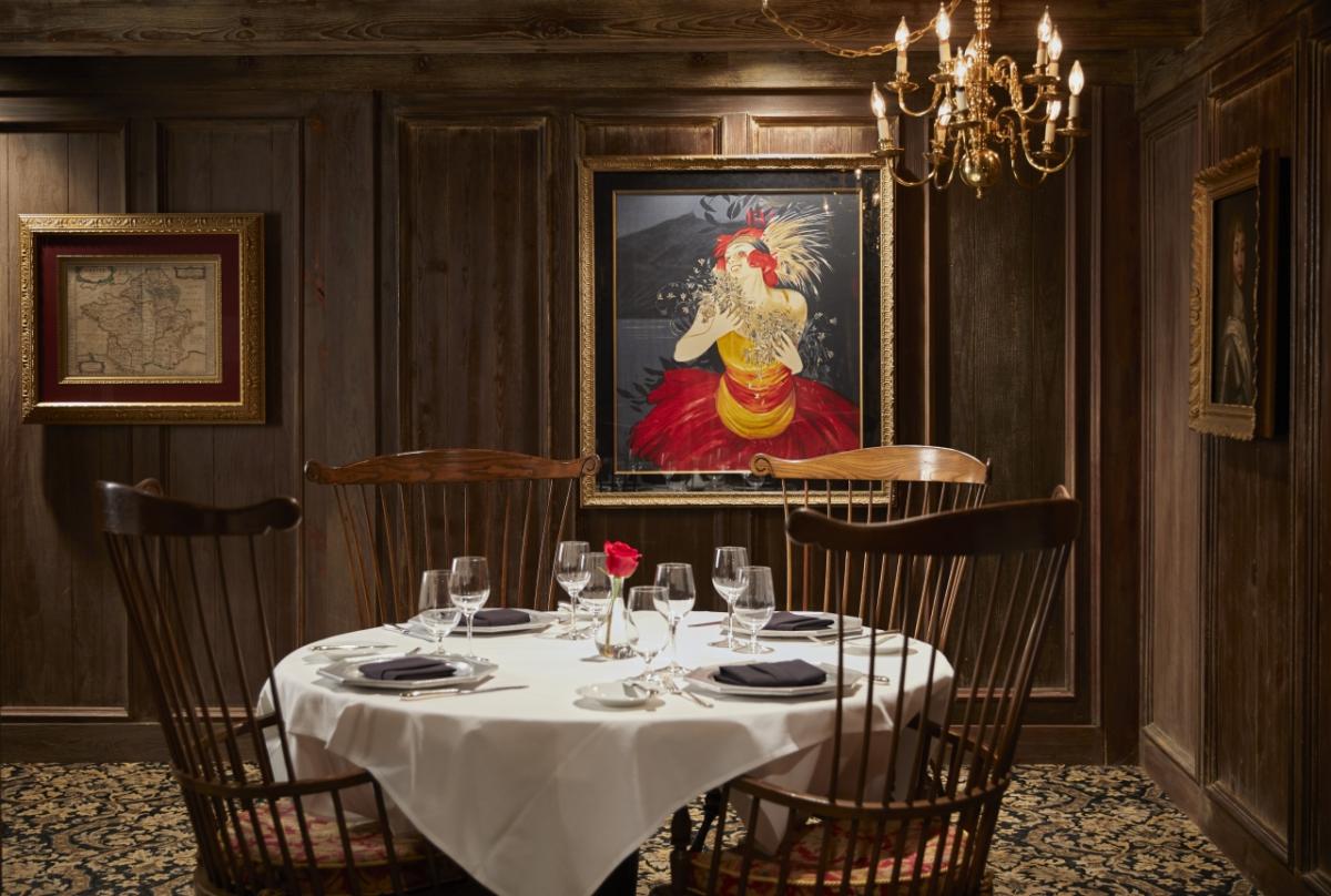 Restaurant table with paintings in the background