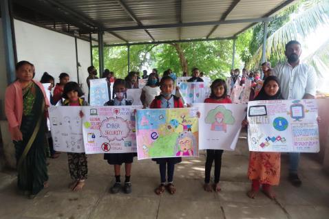a group of school children holding handmade posters