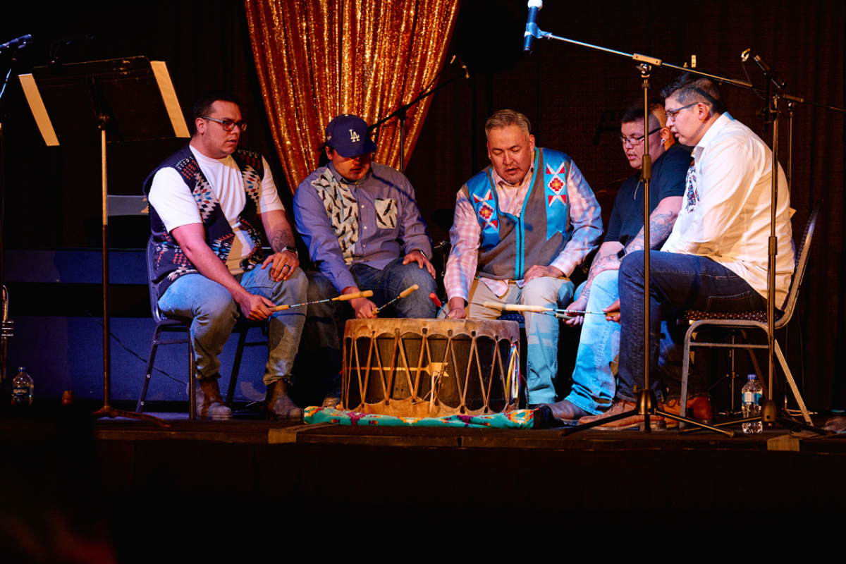 People drumming onstage