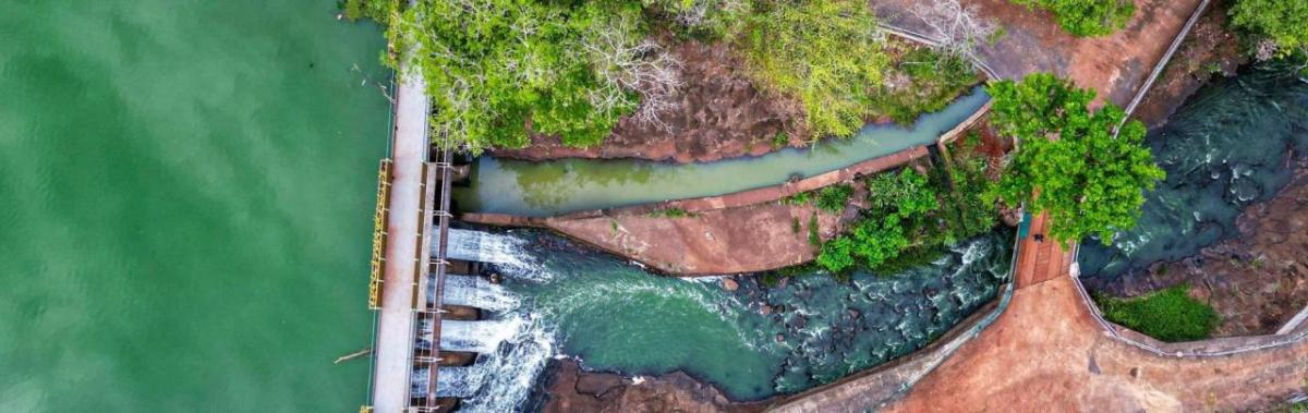 Aerial view of water running through a dam