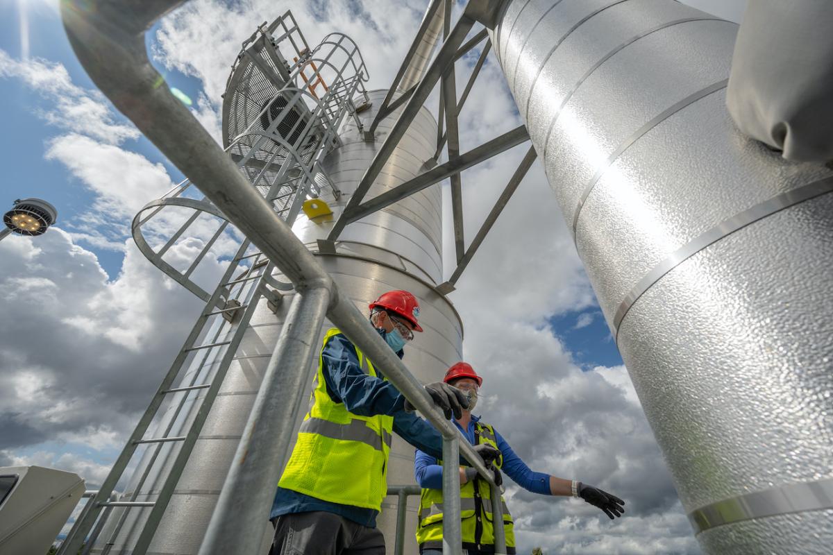 Intel employees Steve Rossow (left) and Mara Howell inspect the company's water recycling facility at its Ronler Acres campus in Hillsboro, Oregon. (Credit: Walden Kirsch/Intel Corporation)