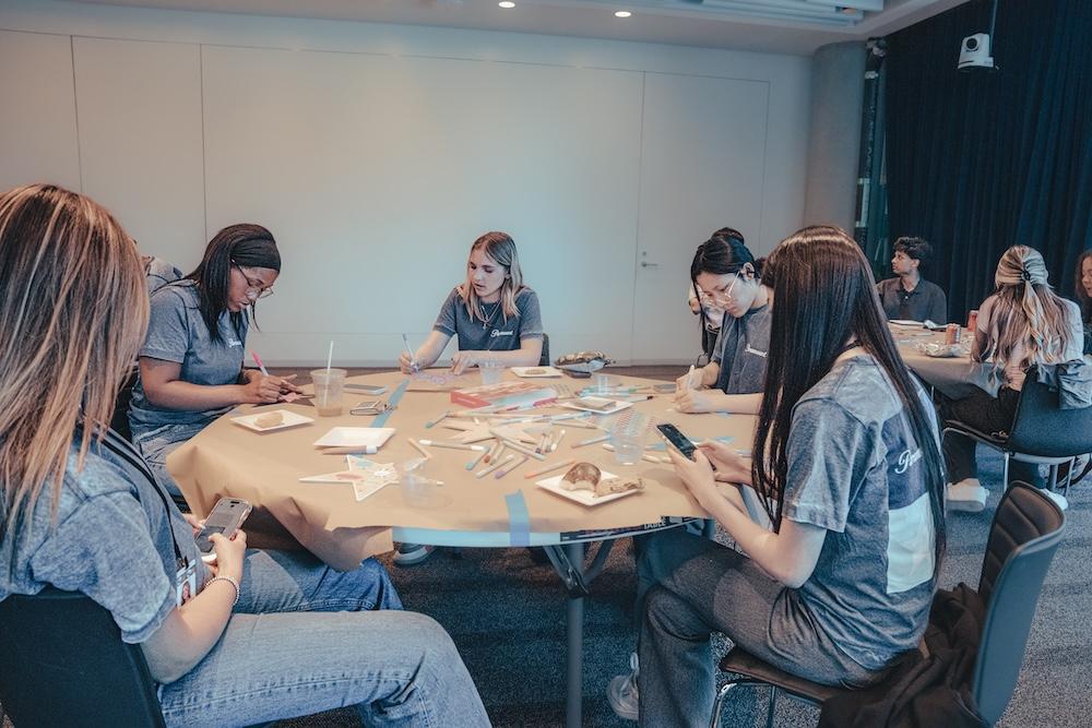 Group of interns seated at table