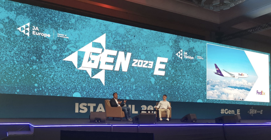 Two people on stage having a discussion at the GEN-E European Entrepreneurship Festival,
