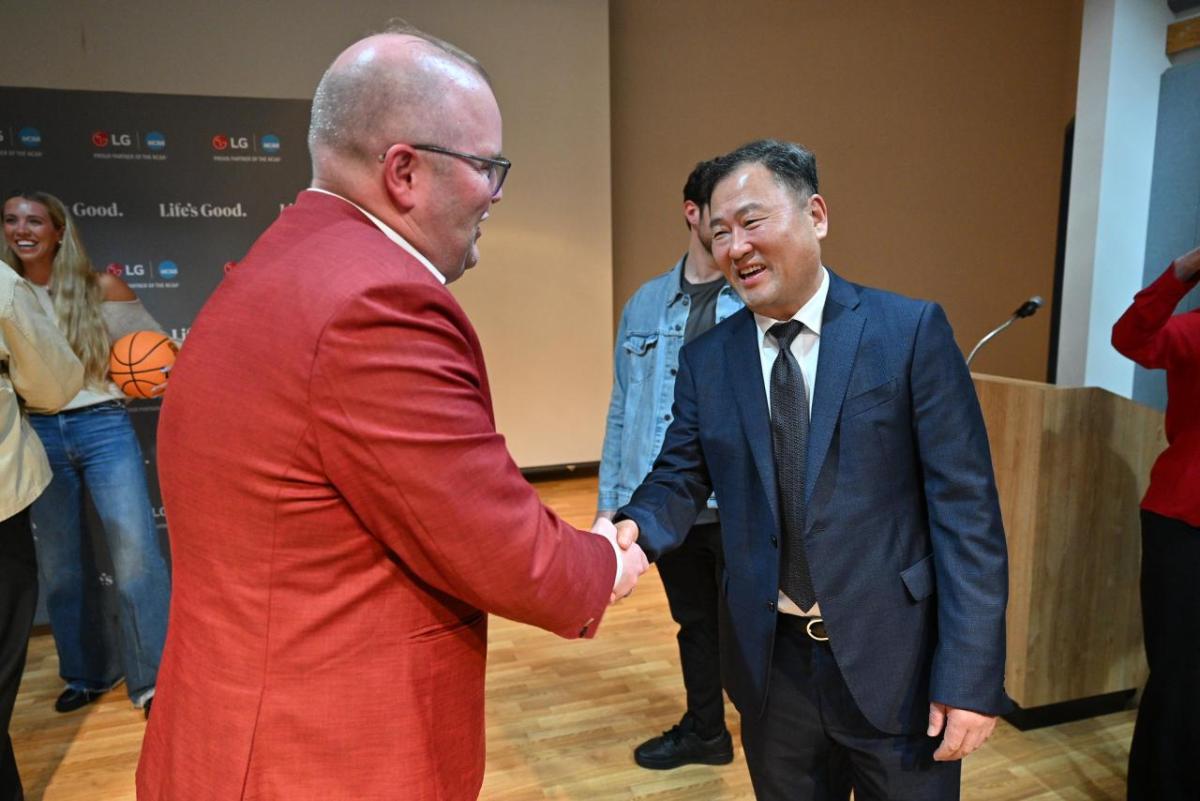 Luke Bosso, athletics director at IU Indianapolis, left, shakes hands with Don Kwack, CEO of LG Electronics North America on Friday, April 3, 2026, in Indianapolis, Indiana.