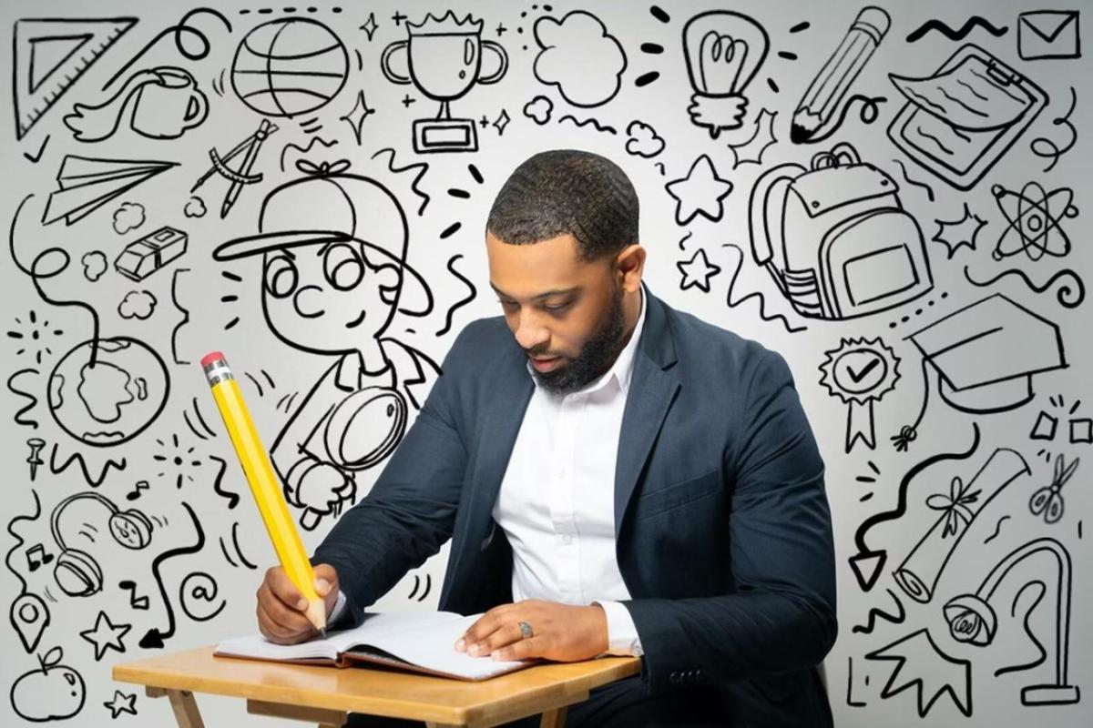 Jalen Roddey sat at a wooden desk, holding a large pencil drawing in a book. With a black and white sketch background behind them