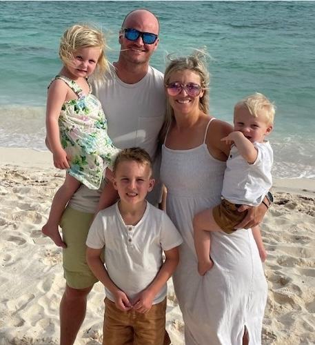 Gillman, her husband and kids at the beach.