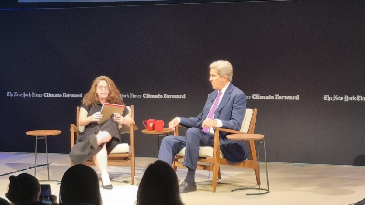 John Kerry and interviewer on stage