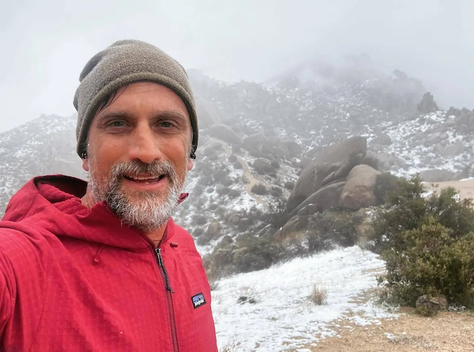 Jonathan doing a winter hike.