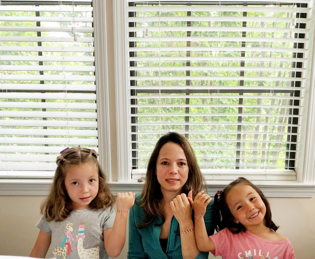 Juanita Pelaez and her daughters wear their menstrual hygiene action bracelets proudly in support of Menstrual Hygiene Day to help end period stigma. Juanita Pelaez and her daughters
