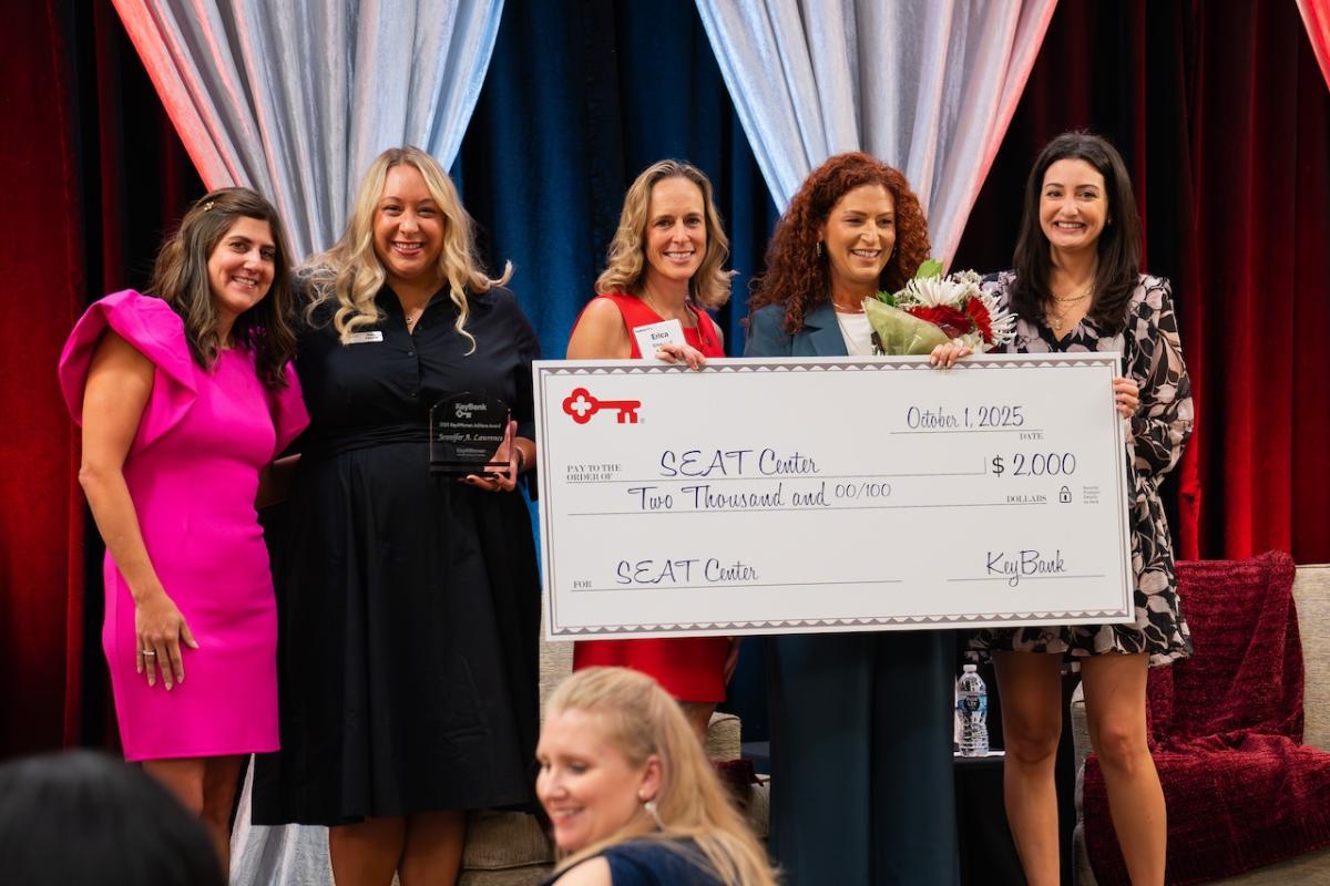  Key4Women Committee members present that annual Achieve Award to SEAT CEO and Founder Jennifer Lawrence. SEAT also received a $2,000 donation.  