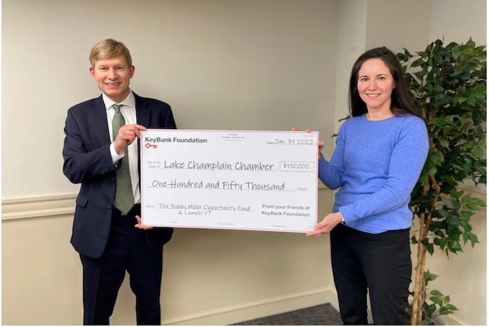 Photo caption: KeyBank Vermont Market President Don Baker presents a grant for $150,000 to Lake Champlain Chamber President Cathy Davis to support the Bobby Miller Opportunity Fund and LaunchVT. Photo credit: KeyBank 