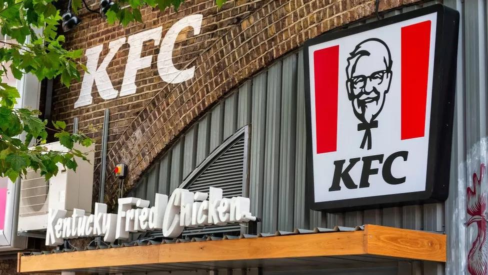 Exterior of KFC building With KFC logo and Kentucky Fried Chicken signs.
