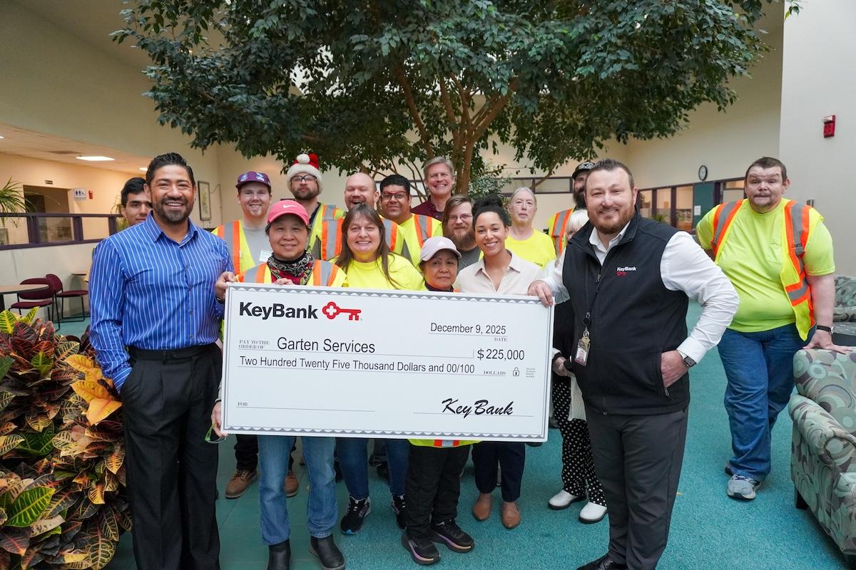 Representatives from Garten Services and KeyBank shown with  $225,000 grant check.