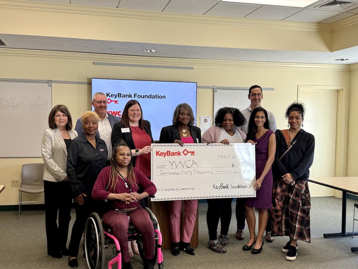 Team members from KeyBank and YWCA shown with the $240,000 grant check.