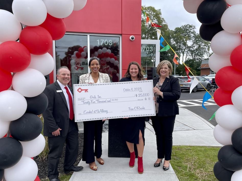 Check presentation to Girls Inc. by KeyBank team.