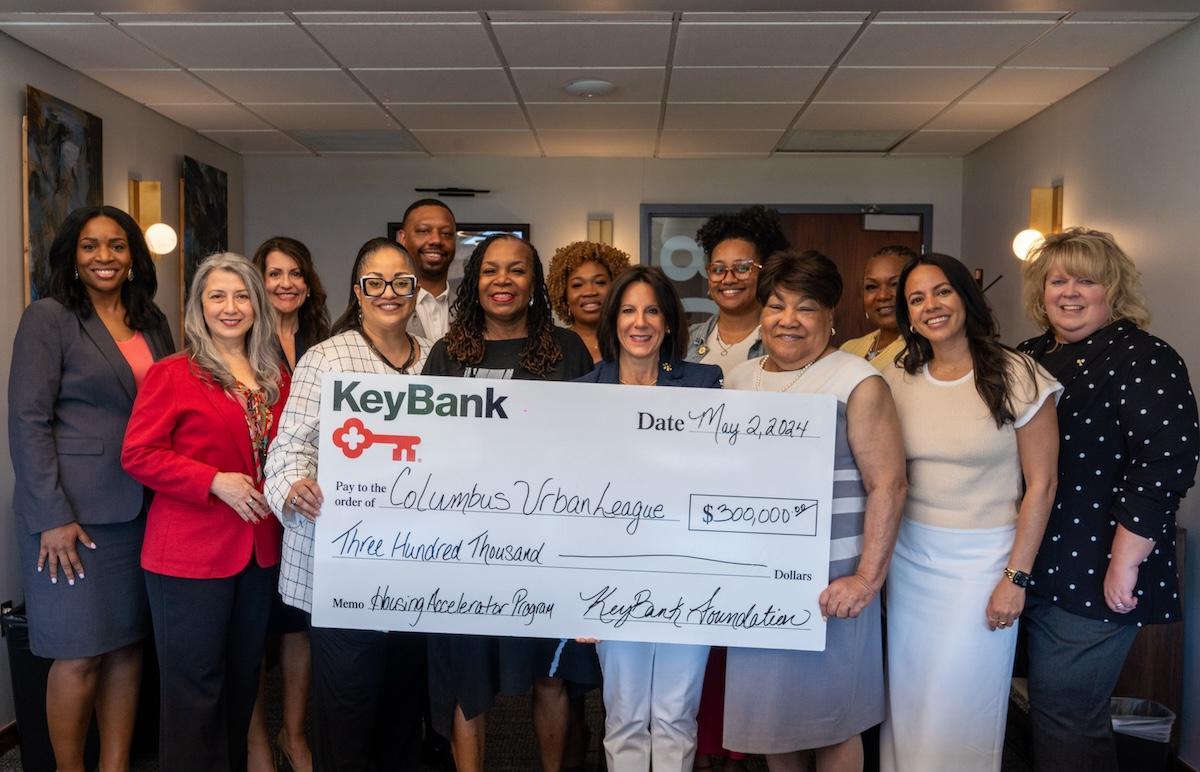 The Columbus Urban League and KeyBank representatives shown with a $300,000 grant check.