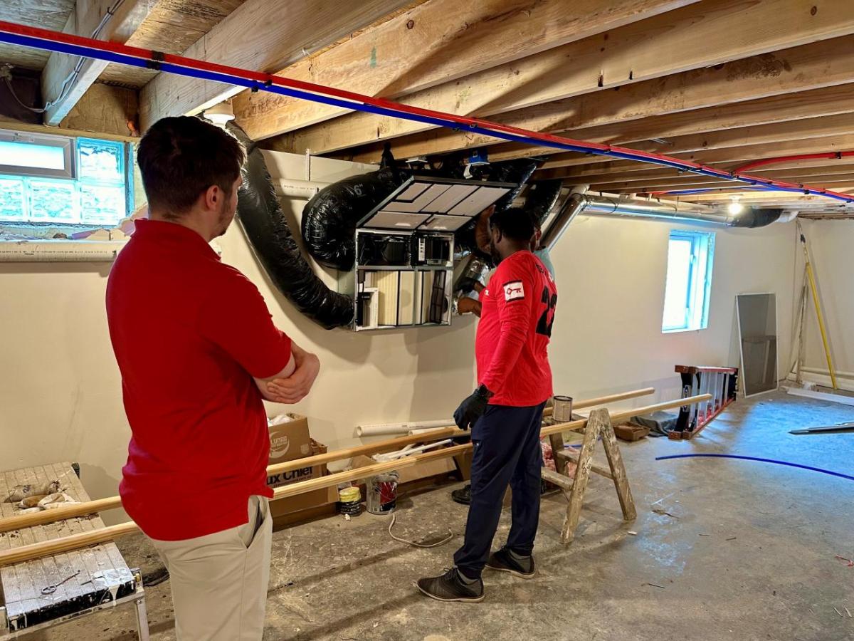 KeyBank representatives shown inspecting a newly built home.