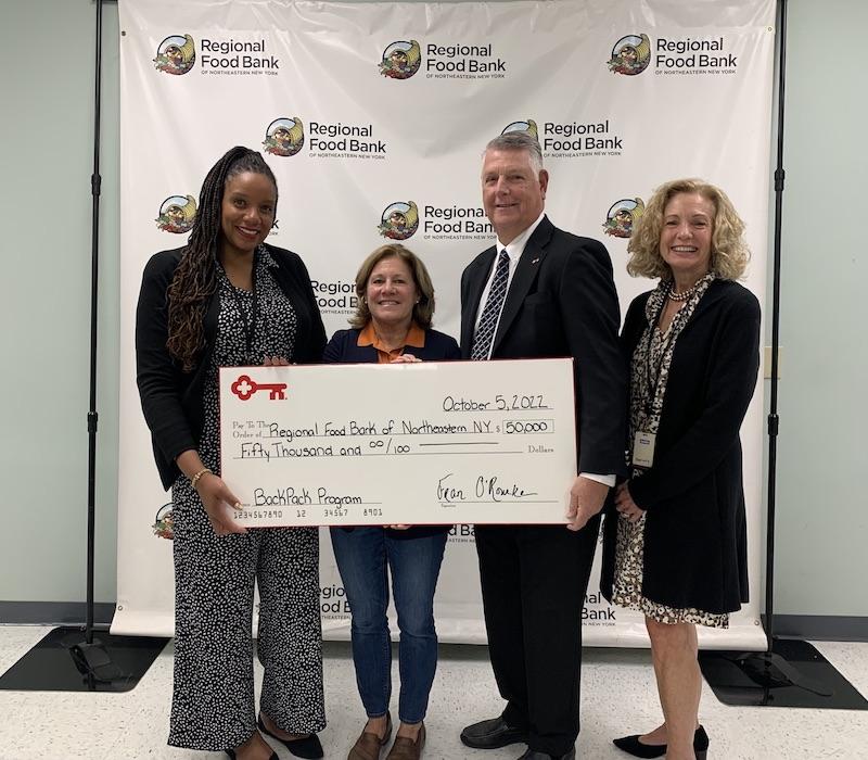 Photo: L-R: Tamika Otis, Molly Nicol, Kevin Reilly, Laura Dehmer KeyBank Foundation members present a check to the Northeastern Food Bank.