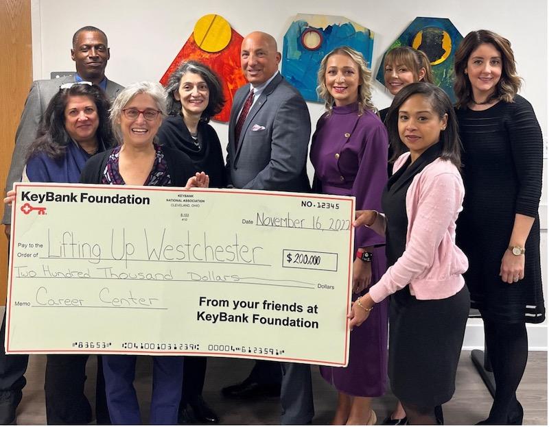 Photo: Pictured from left: Charles Stott, LUW Director of Shelters; Willa Brody, LUW Chief Operating Officer; Deborah Hertz, LUW Director of Program Design; Anahaita Kotval, LUW Chief Executive Officer: John Manginelli, KeyBank Market President, Elona Shape, KeyBank Area Retail Leader; Analisha Michanczyk, KeyBank Corporate Responsibility Office, Sybil St. Germain, KeyBank Philanthropy Coordinator; and Edona Ismaji, KeyBank Experience Leader. Pictured from left: Charles Stott, LUW Director of Shelters; Willa Brody, LUW Chief Operating Officer; Deborah Hertz, LUW Director of Program Design; Anahaita Kotval, LUW Chief Executive Officer: John Manginelli, KeyBank Market President, Elona Shape, KeyBank Area Retail Leader; Analisha Michanczyk, KeyBank Corporate Responsibility Office, Sybil St. Germain, KeyBank Philanthropy Coordinator; and Edona Ismaji, KeyBank Experience Leader.