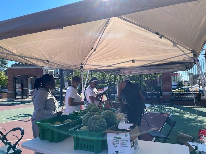 Buffalo community members shopping at the Farmers Market.