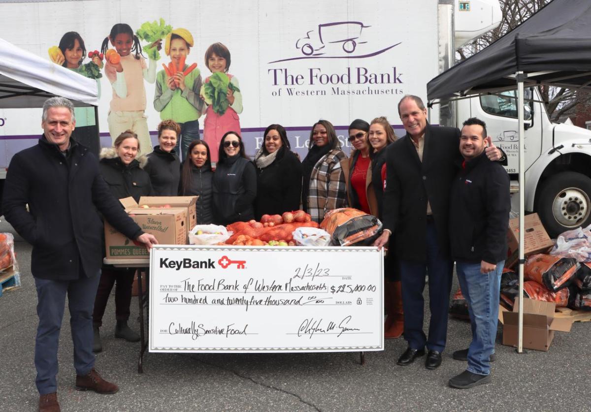 KeyBank and The Food Bank volunteers shown with check.