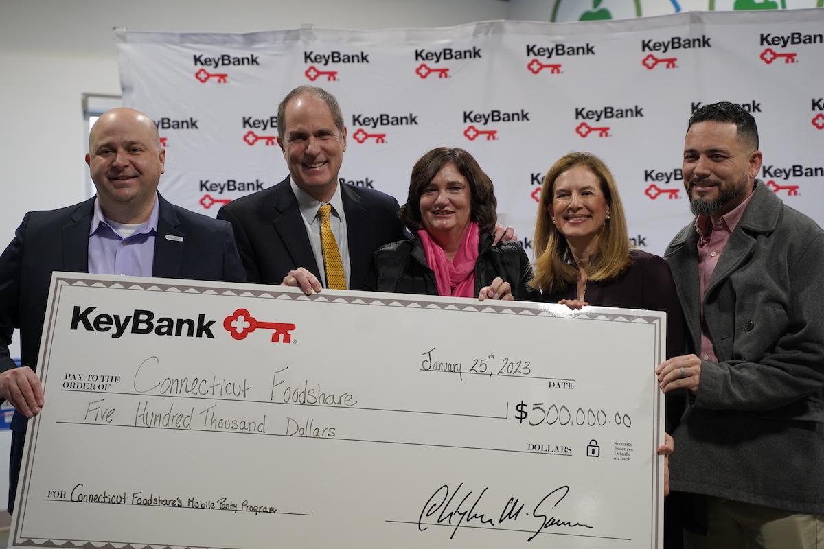 KeyBank and Conn Foodshare team with grant check.