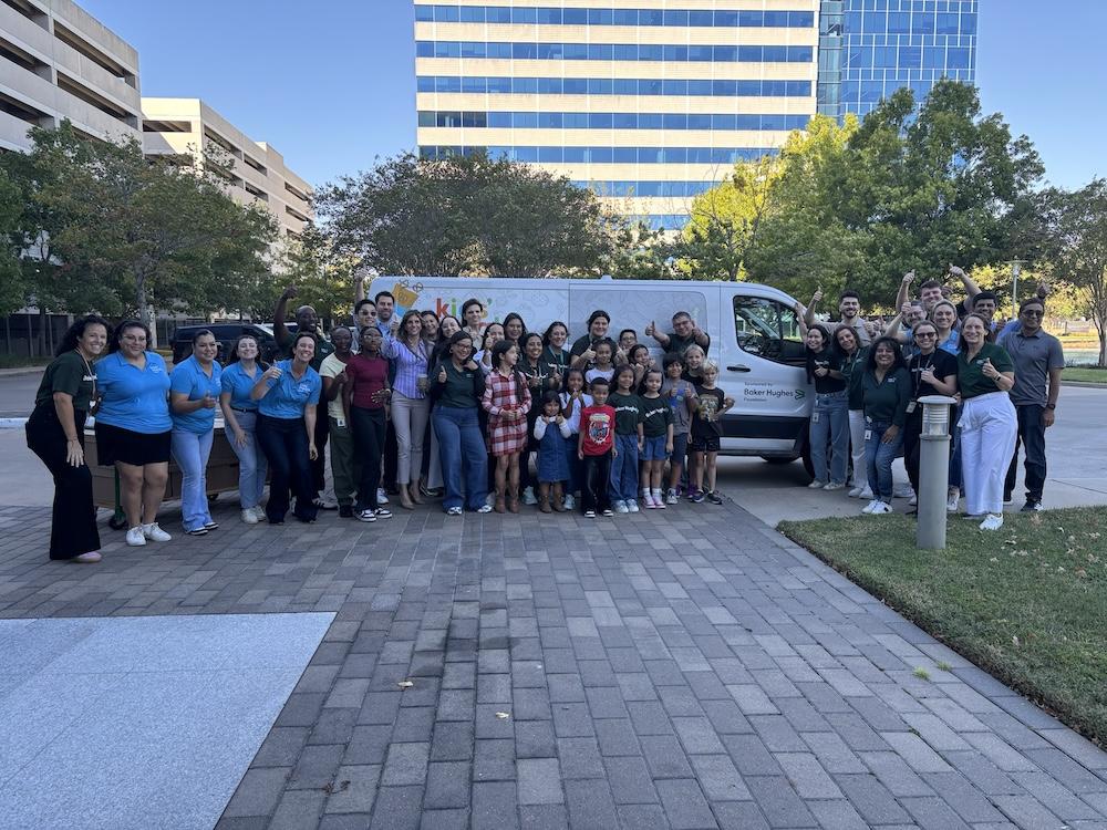 Group picture in front of the delivery van that Baker Hughes has donated to Kids' Meals