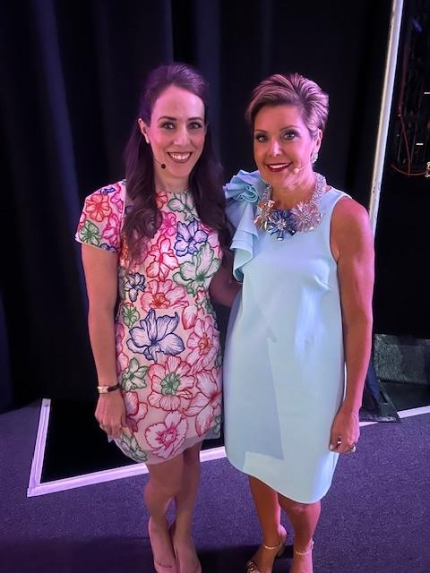 Naisha Covarrubias smiling for a photo with one other person