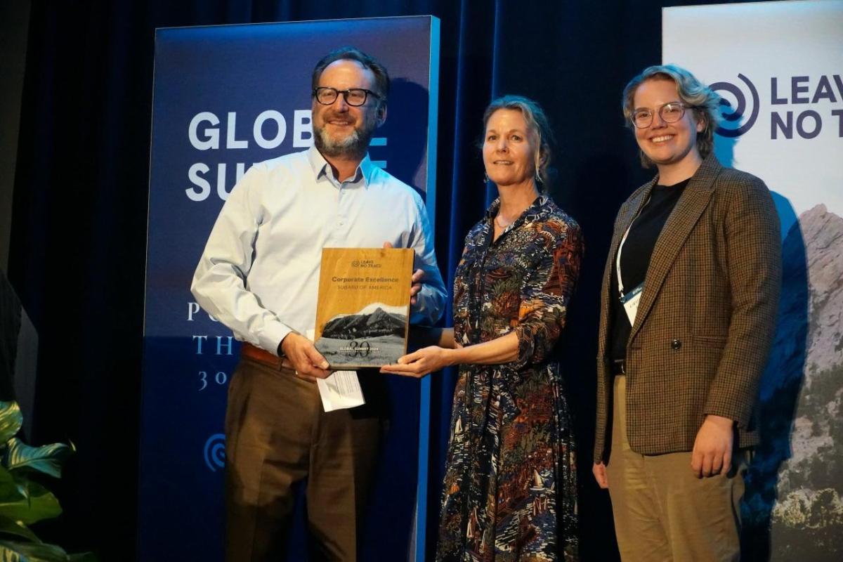 Leave No Trace recognizes Subaru of America with the 2024 Corporate Excellence Award in honor of the automaker’s commitment to environmental sustainability and conservation as the nonprofit’s largest and longest-running corporate partner for the past 25 years. Left to right: Dave Adams, Regional Vice President for the Western Region of Subaru of America, Inc.; Dana Watts, Executive Director of Leave No Trace; and Kirsten Anderson, Brand Partnerships and Experiential Marketing Specialist with Subaru of America, Inc. Photo credit: Leave No Trace Dave Adams, Regional Vice President for the Western Region of Subaru of America, Inc.; Dana Watts, Executive Director of Leave No Trace; and Kirsten Anderson, Brand Partnerships and Experiential Marketing Specialist with Subaru of America, Inc