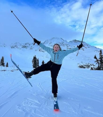 Lindsey Henry shown skiing and doing a stem christie.