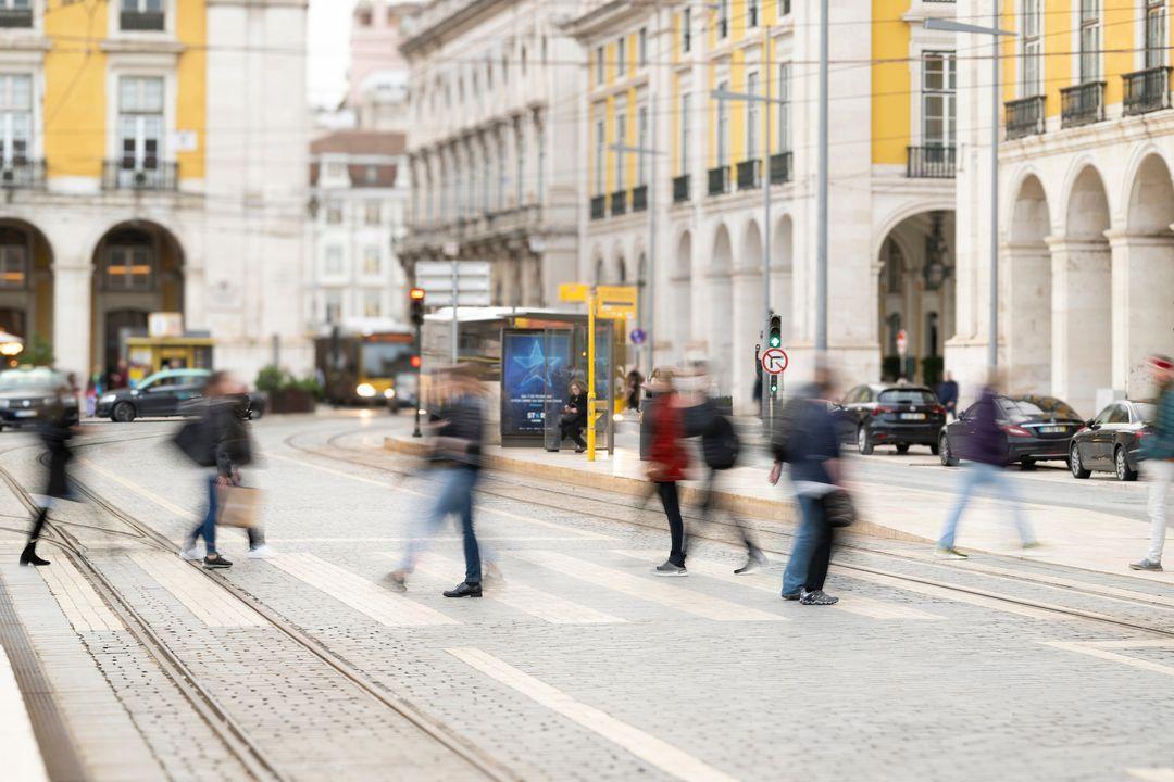 People walking across a street