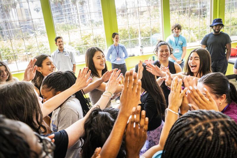 Live Más Scholarship recipients high fiving