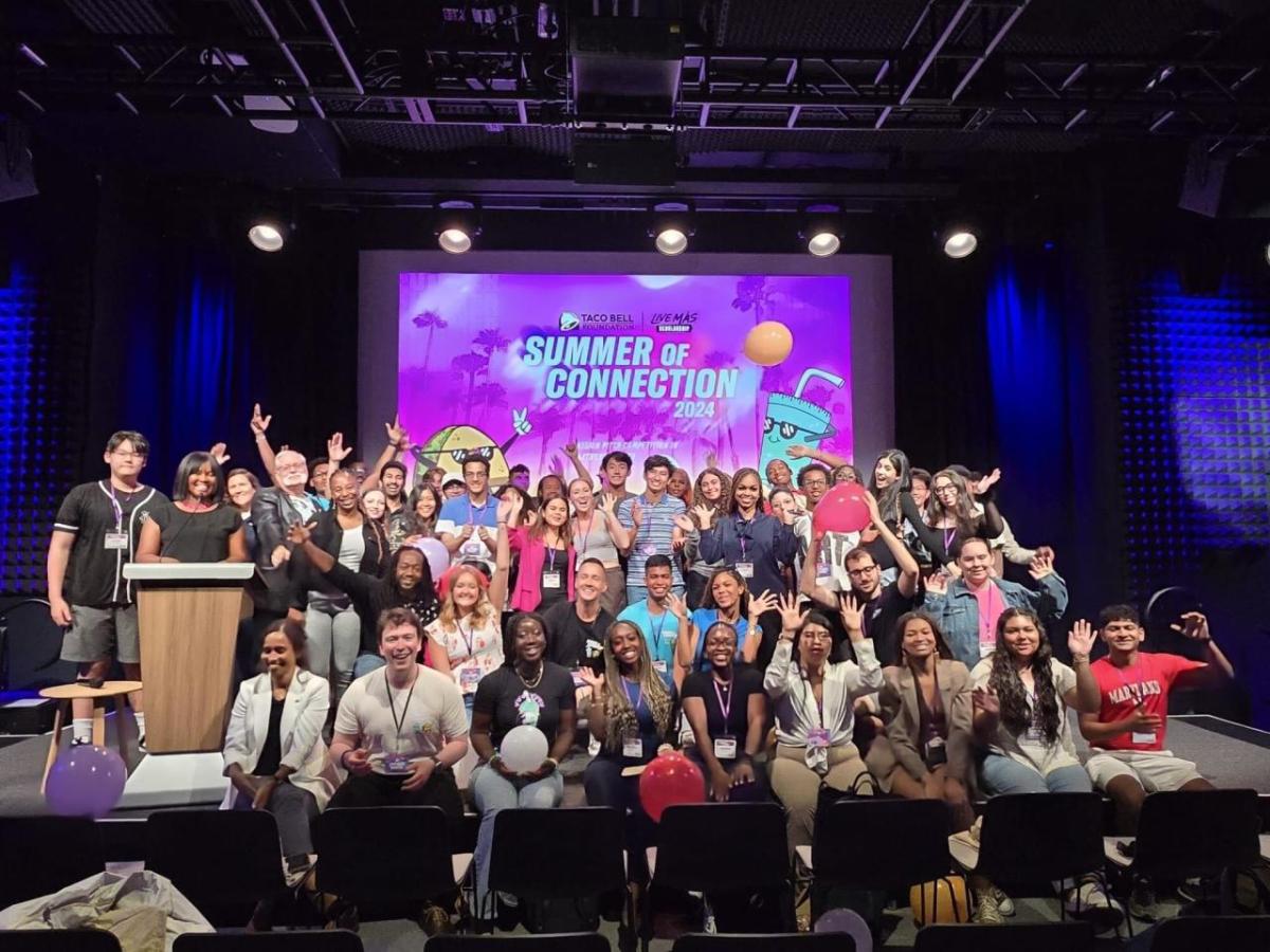 Live Más Scholarship recipients on stage together