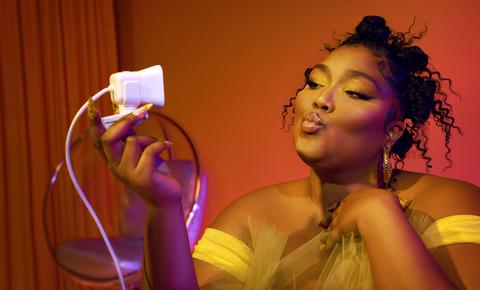 Lizzo recording herself on camera